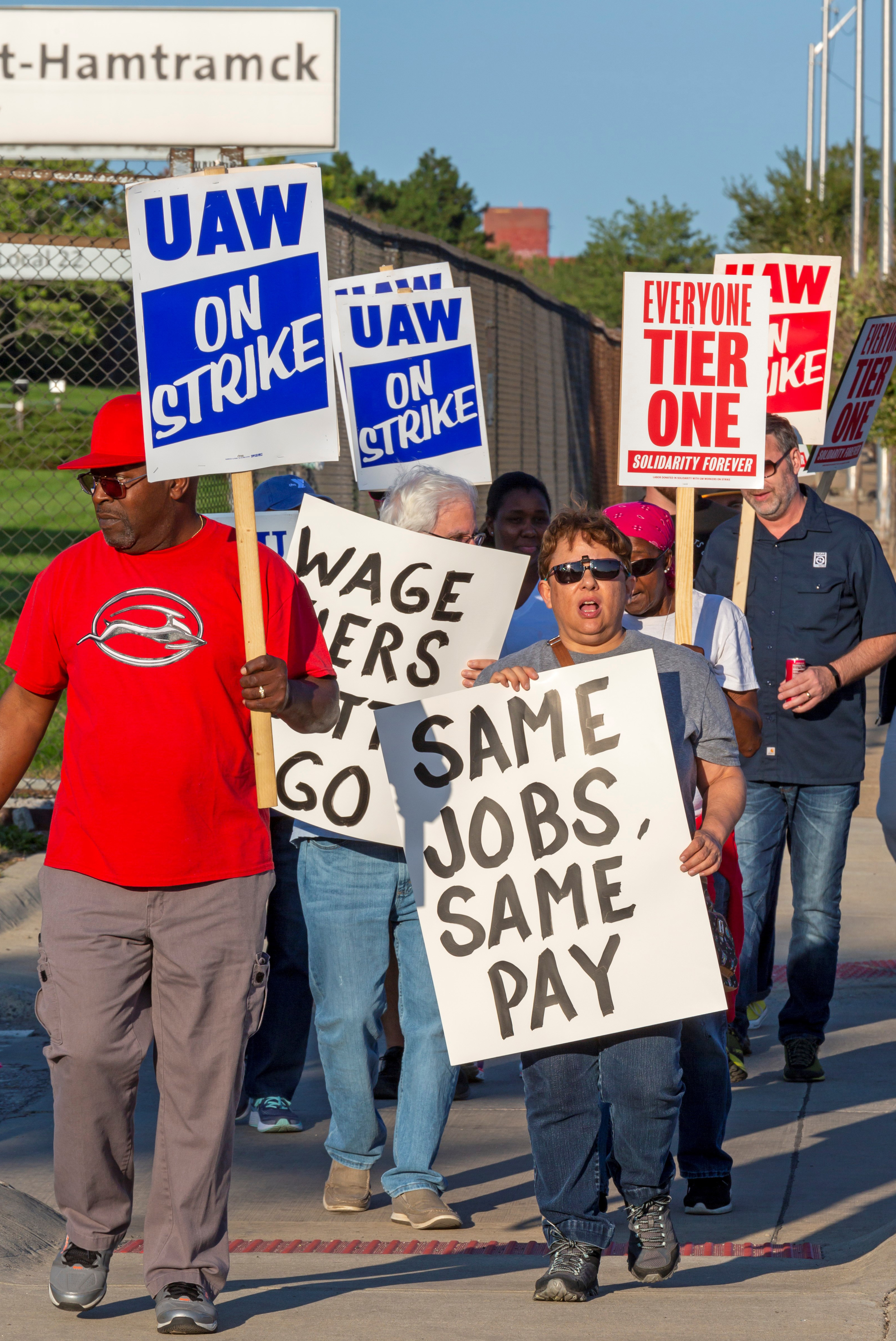 A group of workers holding strike signs.