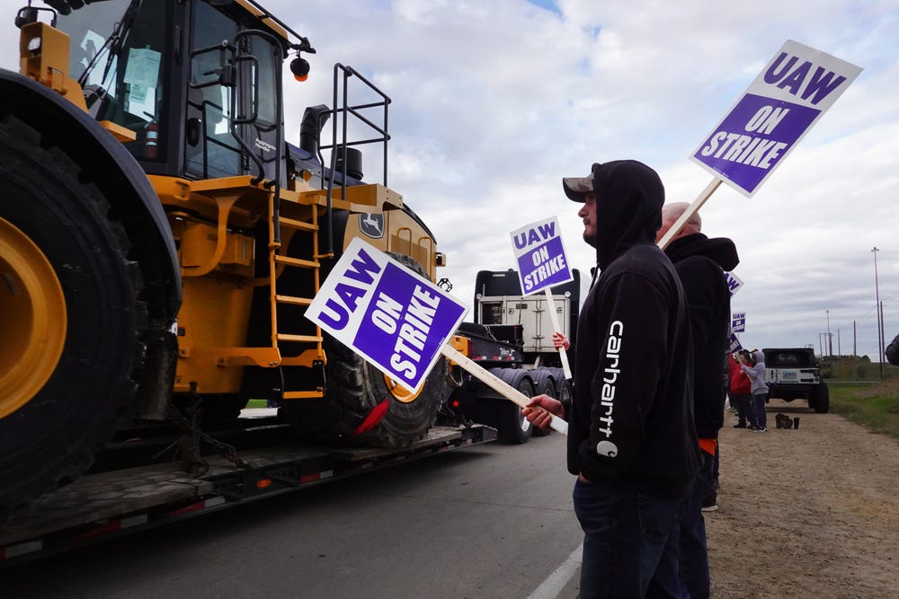 I’m striking at John Deere. We’re tired of layoffs and benefit losses while the company hits record profits.