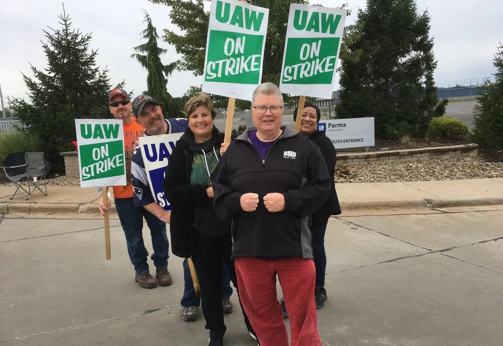 UAW members standing on the picket line.