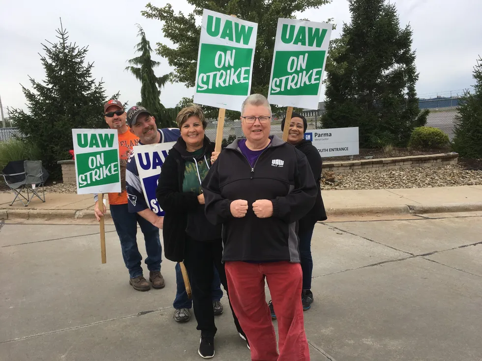 UAW members standing on the picket line.